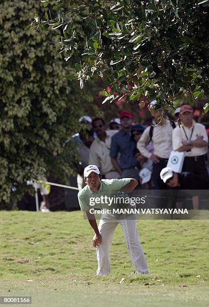 Japanese golfer Taichiro Kiyoto watches his drive on the twelfth green during the final round of the Johnnie Walker Classic 2008 in Gurgaon on the...