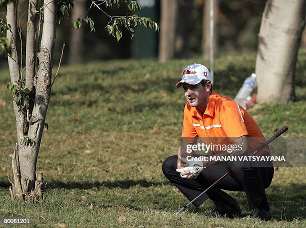 Australian golfer Scott Strange reacts after driving the ball on the eighteenth green during the final round of the Johnnie Walker Classic 2008 in...