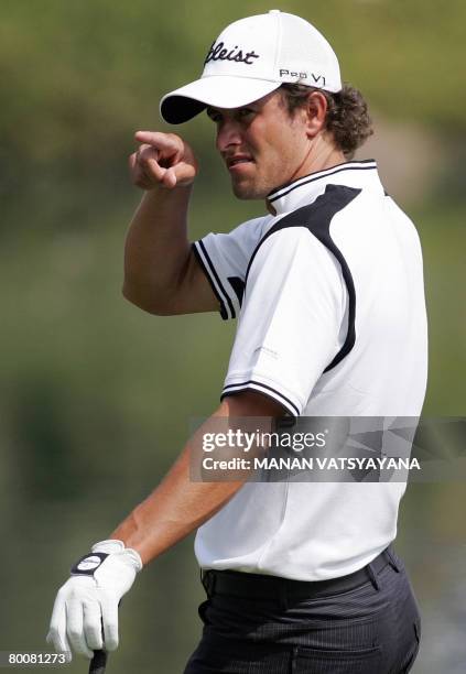 Australian golfer Adam Scott gestures on the seventeenth hole during the final round of the Johnnie Walker Classic 2008 in Gurgaon on the outskirts...