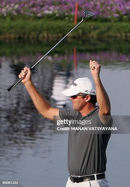 New Zealand golfer Mark Brown celebrates after finishing the eighteenth hole during the Johnnie Walker Classic 2008 in Gurgaon on the outskirts of...