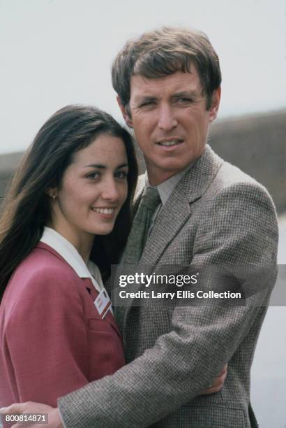English actor John Nettles who appears in character as Jim Bergerac in the television drama series 'Bergerac', posed together with French actress...