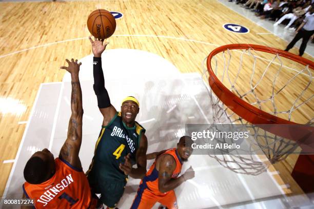 Derrick Byars of the Ball Hogs shoots against DerMarr johnson of 3's Company during week one of the BIG3 three on three basketball league at Barclays...