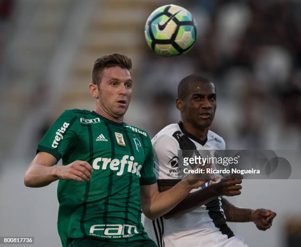 Fabiano of Palmeiras battles for the ball with Marllon of Ponte Preta during the match between Ponte Preta and Palmeiras as a part of Campeonato...