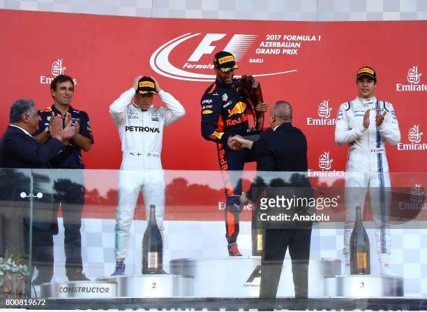 Winner F1 Pilot Daniel Ricciardo of Australia and Red Bull Racing, 2nd placed Mercedes Pilot Valterri Bottas and 3rd placed Williams Martini Racing's...