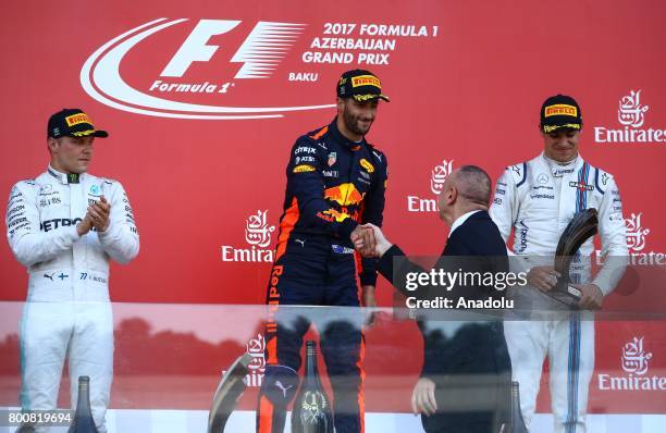 Winner F1 Pilot Daniel Ricciardo of Australia and Red Bull Racing, 2nd placed Mercedes Pilot Valterri Bottas and 3rd placed Williams Martini Racing's...