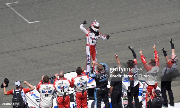 Kevin Harvick, driver of the Mobil 1 Ford, celebrates his victory during the Monster Energy NASCAR Cup Series Toyota/Save Mart 350 at Sonoma Raceway...