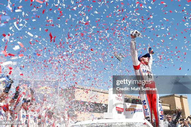 Kevin Harvick, driver of the Mobil 1 Ford, celebrates in victory lane after winning the Monster Energy NASCAR Cup Series Toyota/Save Mart 350 at...