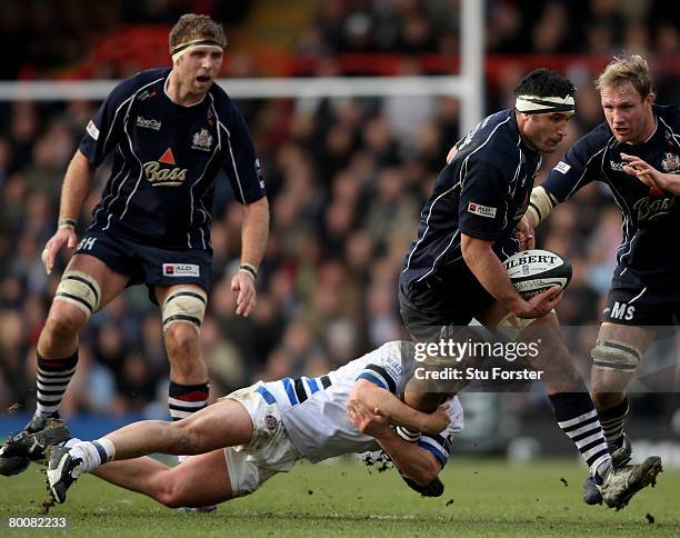 Andrew Blowers of Bristol runs through the attempted tackle of Shaun Berne of Bath during the Guinness Premiership match between Bristol and Bath at...