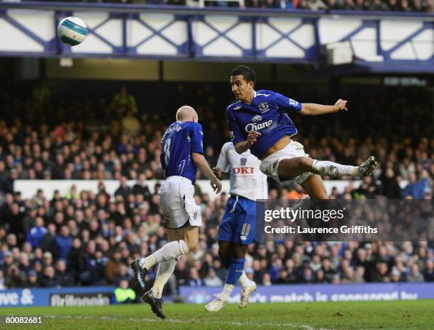 Tim Cahill of Everton scores the second goal during the Barclays Premier League match between Everton and Portsmouth at Goodison Park on March 2,...