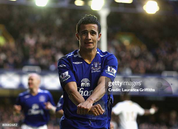 Tim Cahill of Everton celebrates scoring the second goal during the Barclays Premier League match between Everton and Portsmouth at Goodison Park on...