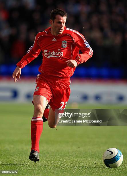 Jamie Carragher of Liverpool in action during the Barclays Premier League match between Bolton Wanderers and Liverpool at The Reebok Stadium on March...