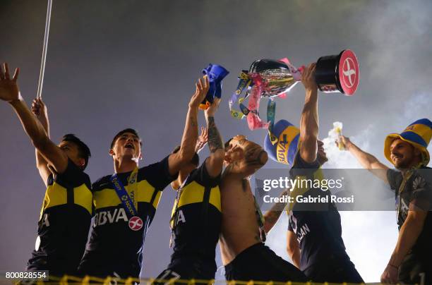 Walter Bou, Jonathan Silva, Nazareno Solis, Ricardo Centurion and Lisandro Magallan of Boca Juniors lift the champions trophy to celebrate after a...