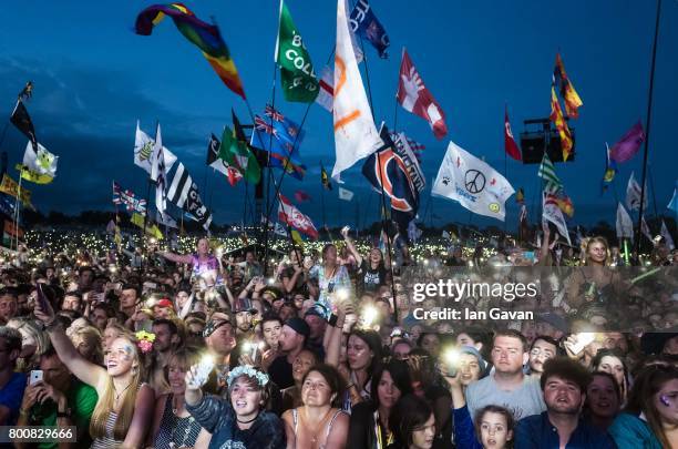 The crowd enjoys the atmosphere as Ed Sheeran headlines on the Pyramid Stage during day 4 of the Glastonbury Festival 2017 at Worthy Farm, Pilton on...