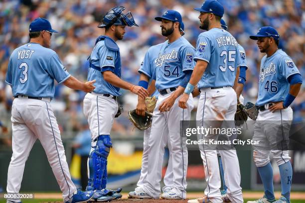 Kansas City Royals relief pitcher Scott Alexander waits to be taken out of the game by Kansas City Royals manager Ned Yost in the sixth inning after...