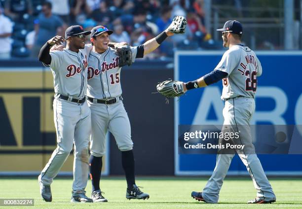 Justin Upton of the Detroit Tigers, left, Mikie Mahtook, center, and J.D. Martinez celebrate after beating the San Diego Padres 7-5 in a baseball...