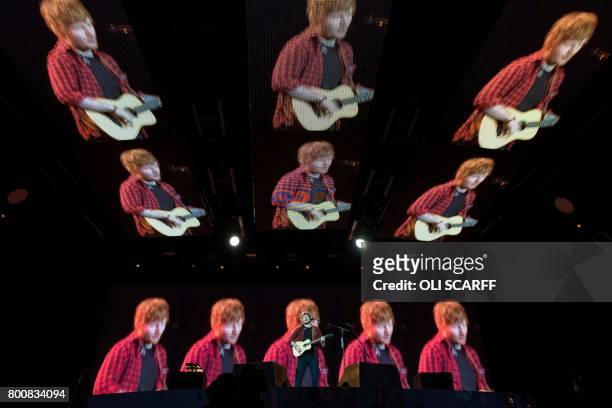 Ed Sheeran performs on the Pyramid Stage at the Glastonbury Festival of Music and Performing Arts on Worthy Farm near the village of Pilton in...