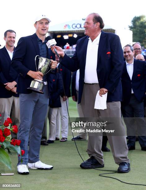 Jordan Spieth of the United States is interviewed by Chris Berman after winning the Travelers Championship at TPC River Highlands on June 25, 2017 in...