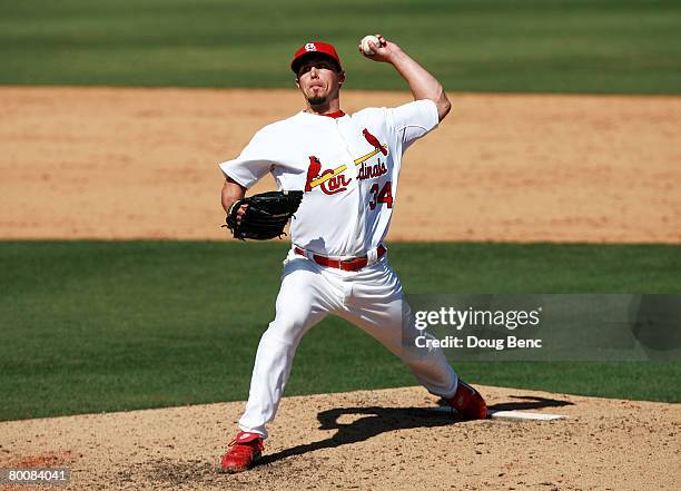 Pitcher Randy Flores of the St. Louis Cardinals pitches against the Florida Marlins during a Spring Training game at Roger Dean Stadium on March 2,...
