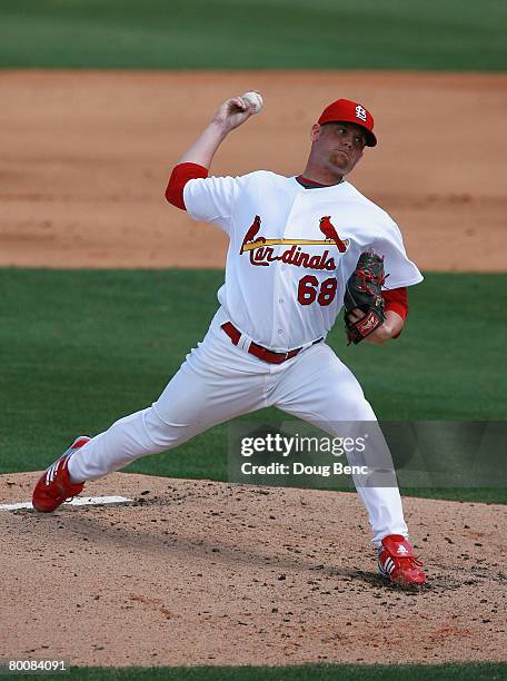 Starting pitcher Kyle McClellan of the St. Louis Cardinals pitches against the Florida Marlins during a Spring Training game at Roger Dean Stadium on...