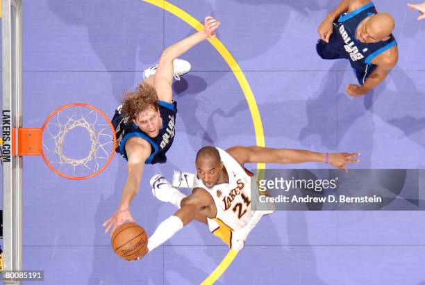 Kobe Bryant of the Los Angeles Lakers goes to the basket against Dirk Nowitzki of the Dallas Mavericks at Staples Center on March 2, 2008 in Los...