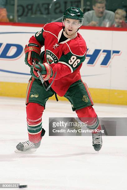 Pierre-Marc Bouchard of the Minnesota Wild passes the the puck against the Los Angeles Kings during the game at Xcel Energy Center on March 2, 2008...
