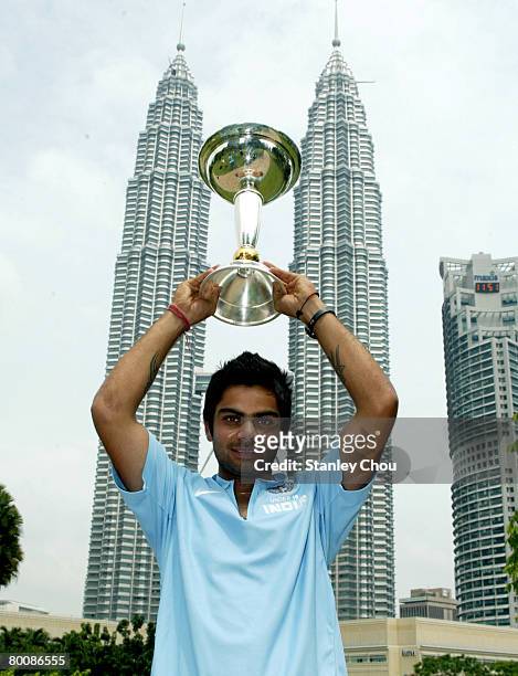 Virat Kohli of India poses with the ICC U19 Cricket World Cup at the Kuala Lumpur Twin Towers on March 3, 2008 in Kuala Lumpur, Malaysia.