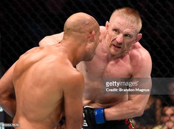 Dennis Siver of Germany punches BJ Penn in their featherweight bout during the UFC Fight Night event at the Chesapeake Energy Arena on June 25, 2017...