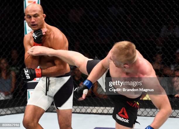 Dennis Siver of Germany kicks BJ Penn in their featherweight bout during the UFC Fight Night event at the Chesapeake Energy Arena on June 25, 2017 in...