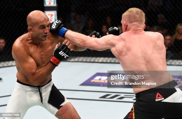 Dennis Siver of Germany punches BJ Penn in their featherweight bout during the UFC Fight Night event at the Chesapeake Energy Arena on June 25, 2017...