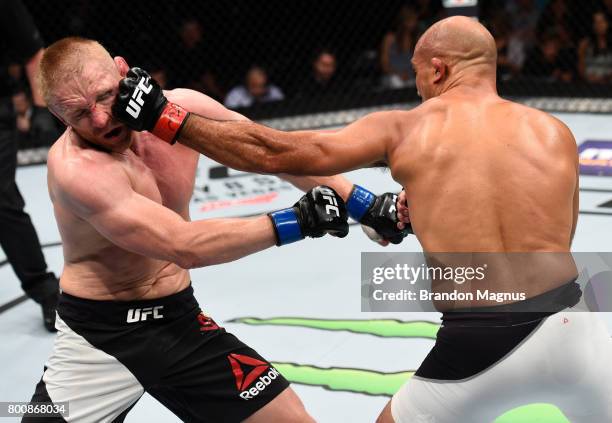 Penn punches Dennis Siver of Germany in their featherweight bout during the UFC Fight Night event at the Chesapeake Energy Arena on June 25, 2017 in...