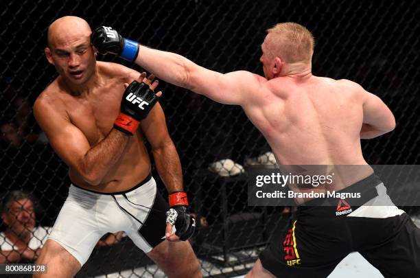 Dennis Siver of Germany punches BJ Penn in their featherweight bout during the UFC Fight Night event at the Chesapeake Energy Arena on June 25, 2017...