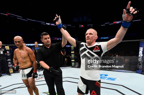 Dennis Siver of Germany celebrates after his majority-decision victory over BJ Penn in their featherweight bout during the UFC Fight Night event at...