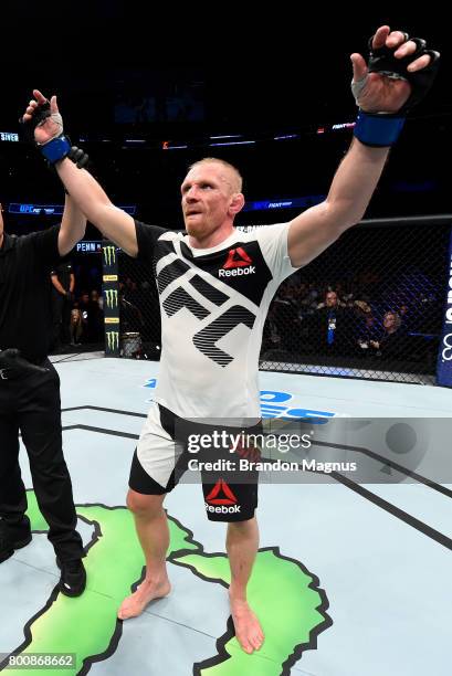 Dennis Siver of Germany celebrates after his majority-decision victory over BJ Penn in their featherweight bout during the UFC Fight Night event at...