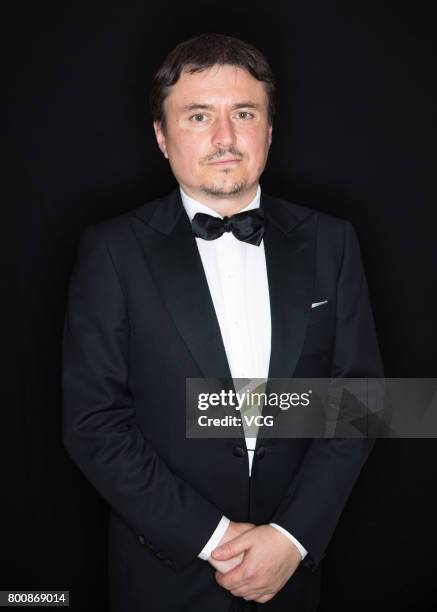 Jury president Romanian director Cristian Mungiu poses at the backstage of Golden Goblet Awards during the 20th Shanghai International Film Festival...