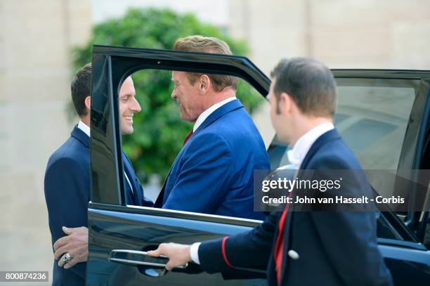 President Emmanuel Macron of France receives the former actor and governor of California Arnold Schwarzenegger on June 23, 2017 in Paris, France at...