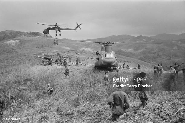 Supply helicopters and artillery on Hill Timothy during preparations for action against the Viet Cong, during the Vietnam War, April 1968.