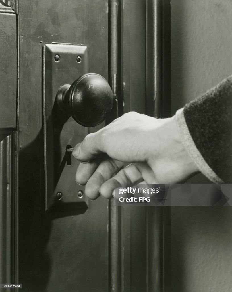 Man locking door, close-up