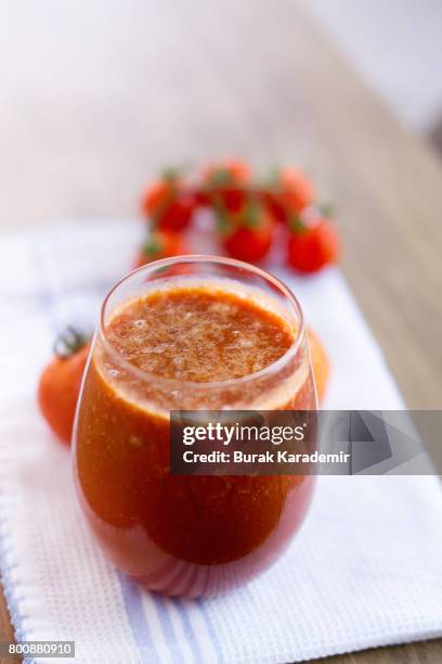 tomato juice on scarf over table - tomatensap stockfoto's en -beelden