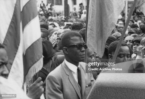 Part of the 150,000-strong crowd following the coffin of assassinated American civil rights leader Martin Luther King Jr between a private service at...