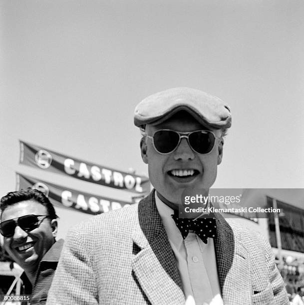 British racing driver Mike Hawthorn smiling at The Race of Two Worlds, Monza, 29th June 1958. He would share a Ferrari ?hot-rod? with Luigi Musso and...