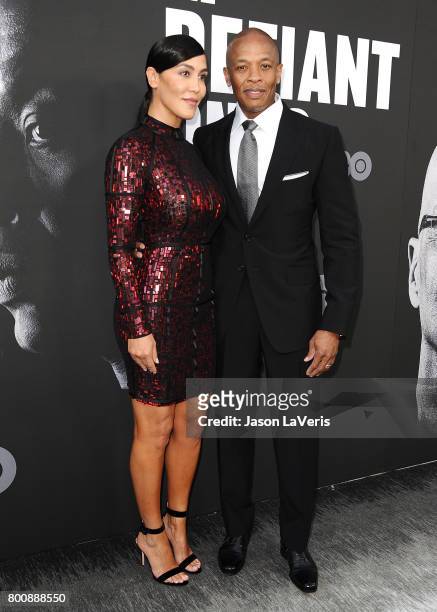 Dr. Dre and wife Nicole Young attend the premiere of "The Defiant Ones" at Paramount Theatre on June 22, 2017 in Hollywood, California.