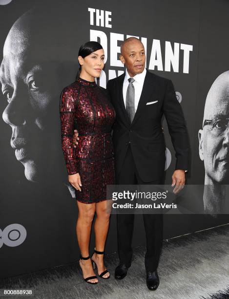 Dr. Dre and wife Nicole Young attend the premiere of "The Defiant Ones" at Paramount Theatre on June 22, 2017 in Hollywood, California.