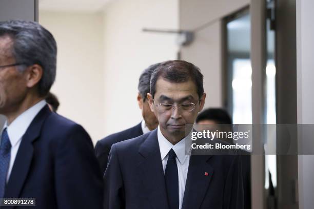 Shigehisa Takada, chairman and chief executive officer of Takata Corp., center, arrives at a news conference in Tokyo, Japan, on Monday, June 26,...