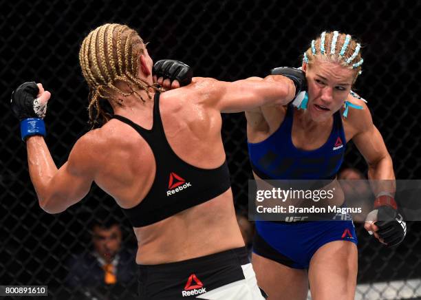 Felice Herrig and Justine Kish trade punches in their women's strawweight bout during the UFC Fight Night event at the Chesapeake Energy Arena on...