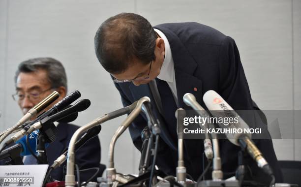Chairman and CEO of Japanese airbag maker Takata Corp., Shigehisa Takada , bows as he attends a press conference in Tokyo on June 26, 2017. Japan's...
