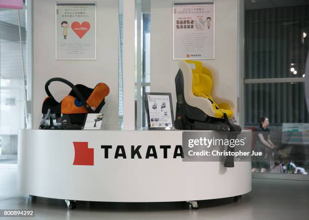 Takata Corp. Logo is seen on a display of child safety seats at a car showroom on June 26, 2017 in Tokyo, Japan. Japanese air bag maker Takata Corp....