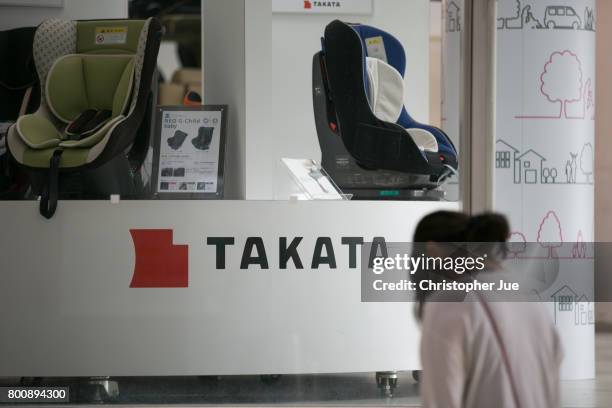 Takata Corp. Logo is seen on a display of child safety seats at a car showroom on June 26, 2017 in Tokyo, Japan. Japanese air bag maker Takata Corp....