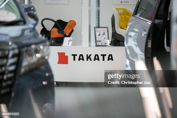 Takata Corp. Logo is seen on a display of child safety seats at a car showroom on June 26, 2017 in Tokyo, Japan. Japanese air bag maker Takata Corp....