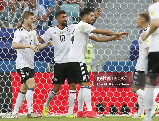 Timo Werner celebrates with teammates after scoring Germany's second goal in the second half of a Group B match against Cameroon in Sochi, Russia, at...