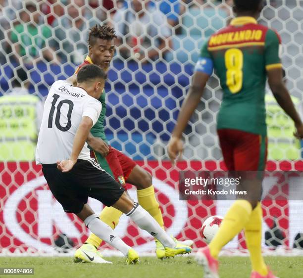 Kerem Demirbay scores Germany's opening goal during the second half of a Group B match against Cameroon at the Confederations Cup in Sochi, Russia,...
